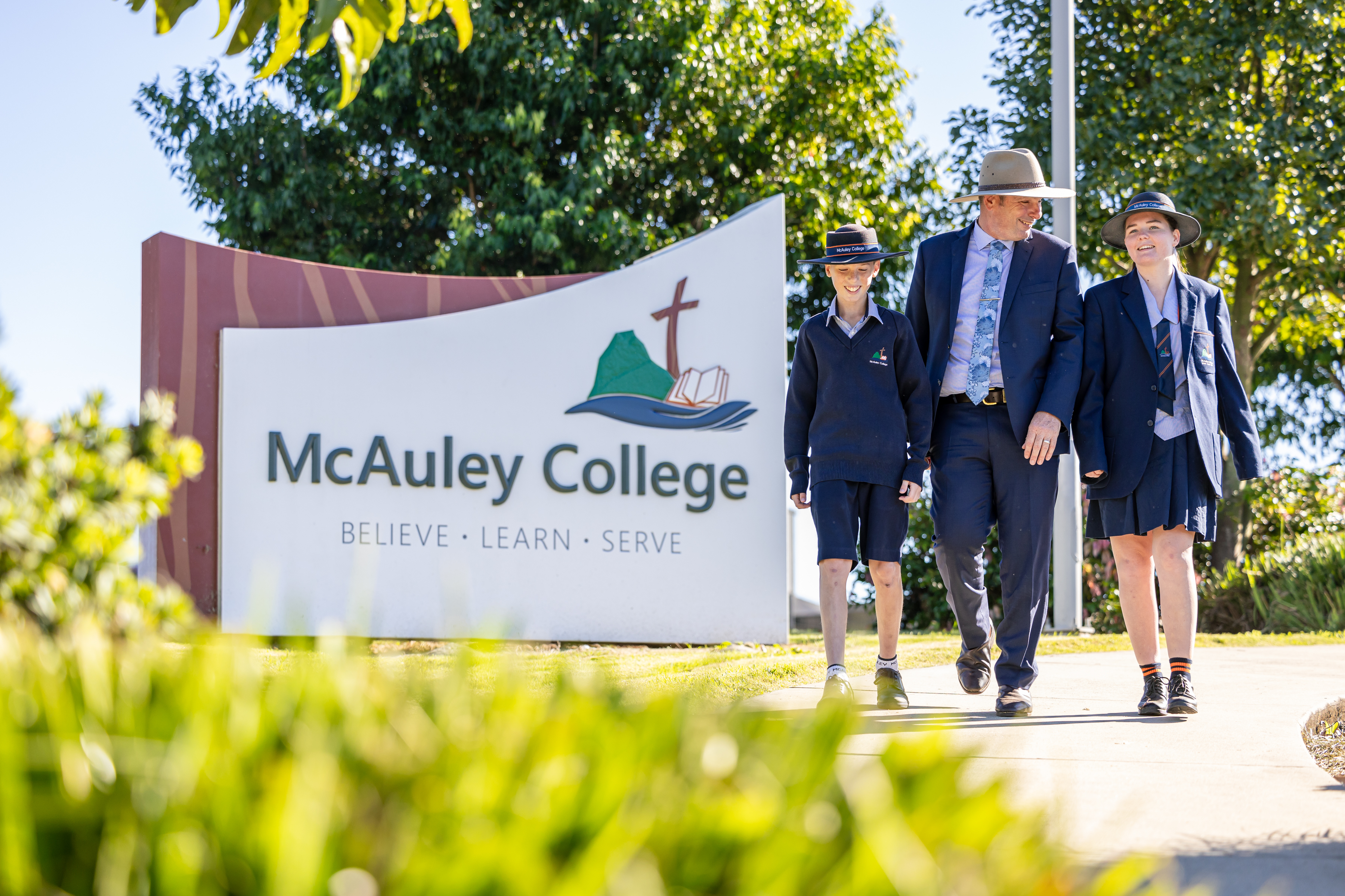Principal walking with students