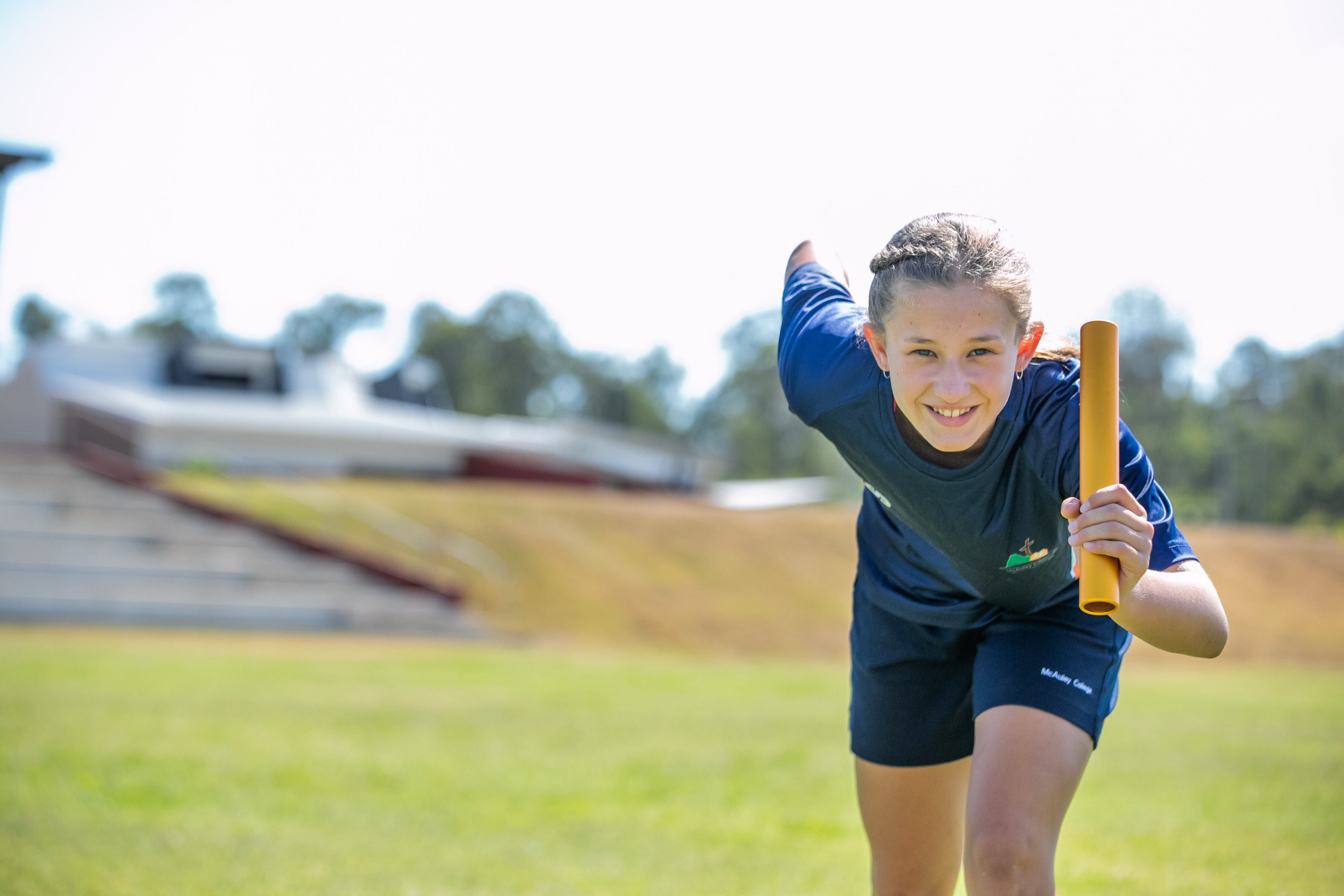 A student preparing to run in a relay race.