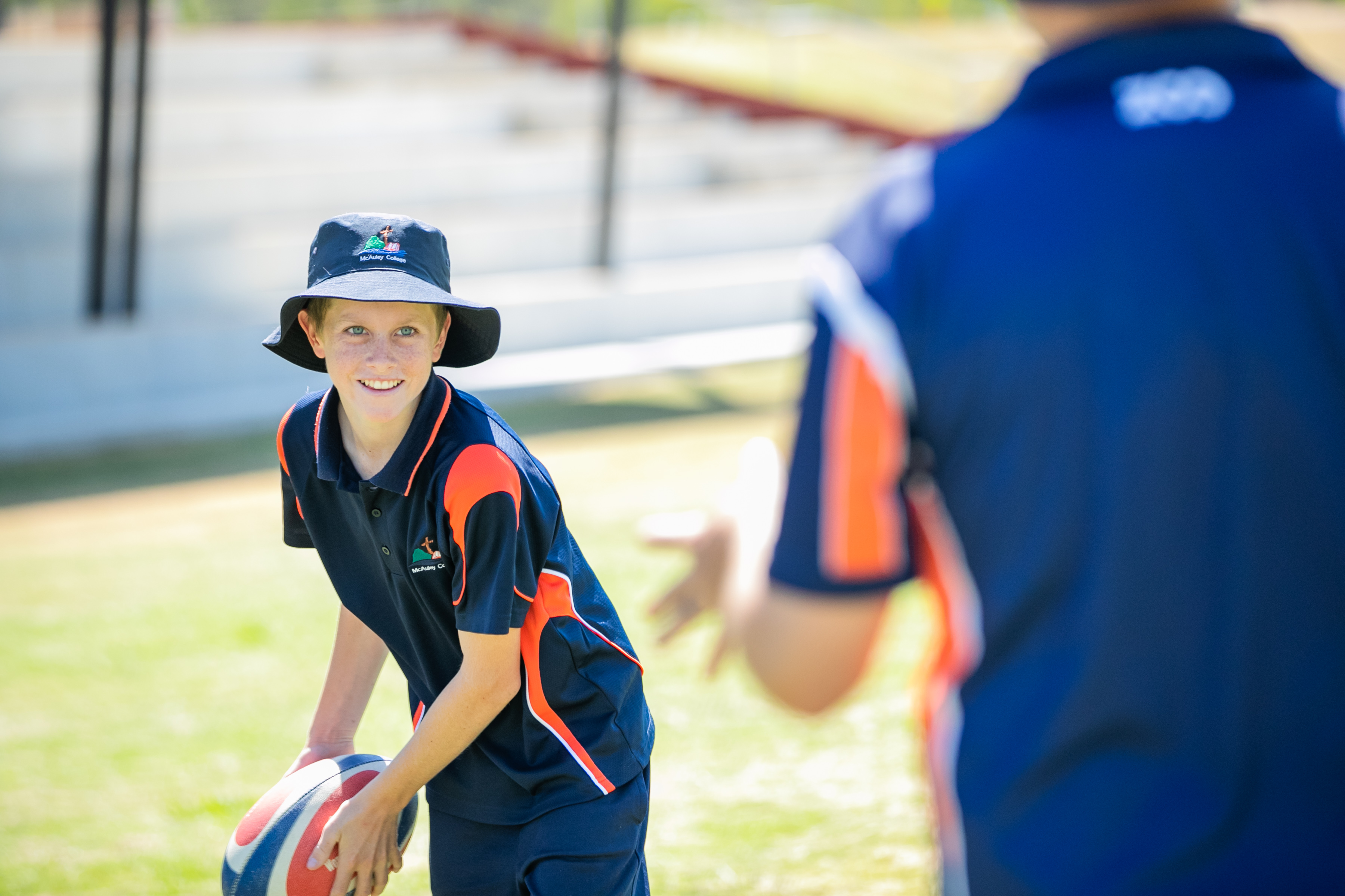 A student is preparing to throw a ball to a coach.